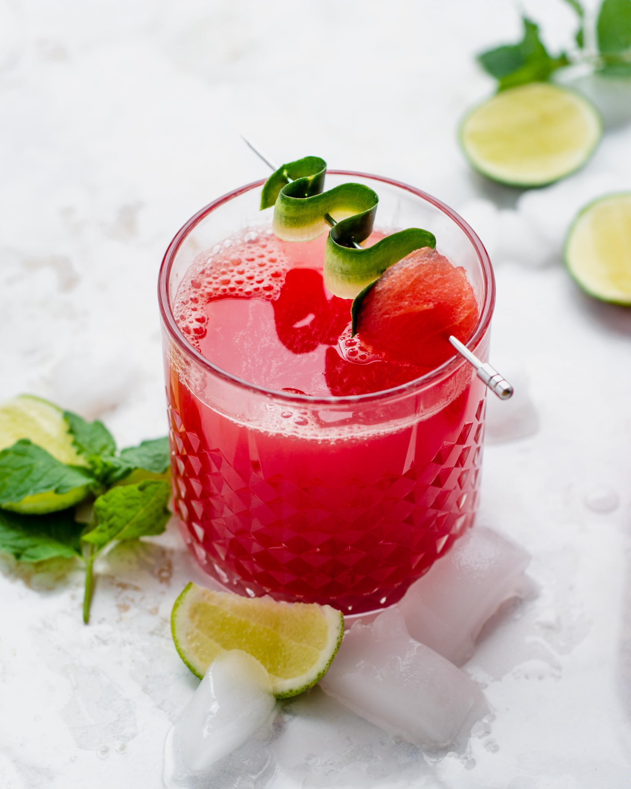 watermelon cucumber margarita in a glass with garnish